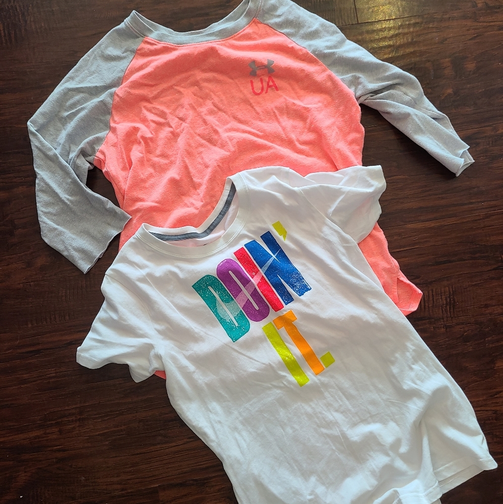 Under Amor and Nike shirts.